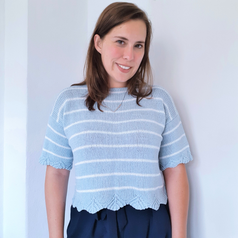 A super sizeinclusive knitting pattern for a dropped shoulder tee with a lovely sea shell pattern detail.