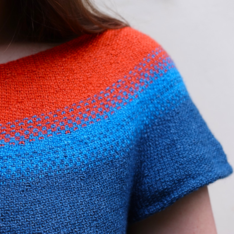 A fun circular yoke summer top knit in linen stitch.